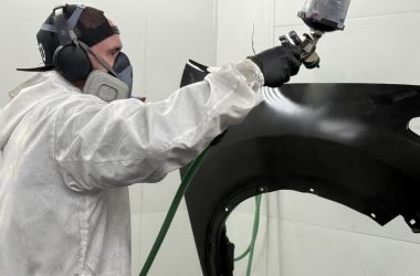 shop-paint-specialist-spraying-refinishing-stock-car-fender